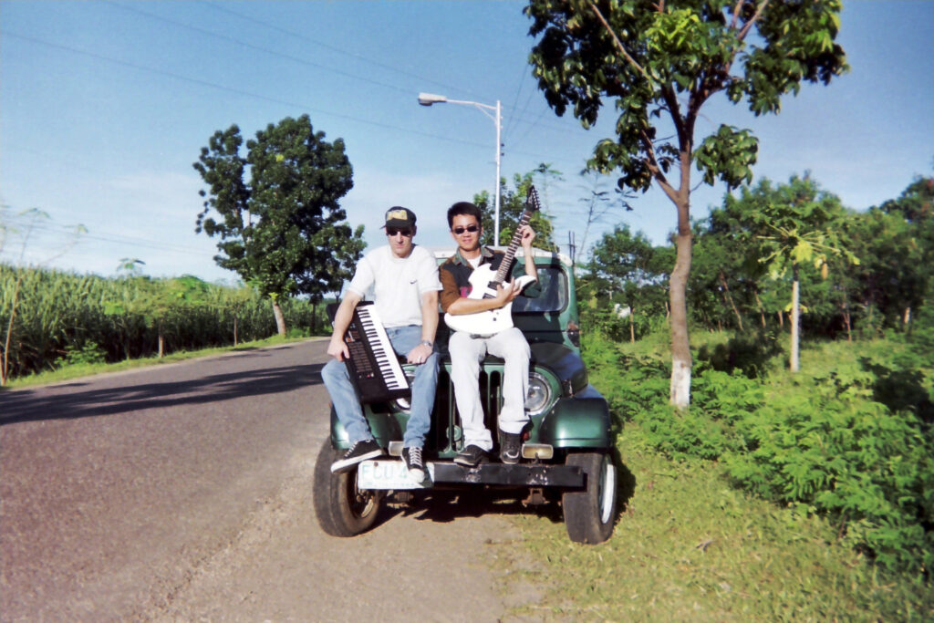 Berny A. Rácz and Robert C. Drilon during the Misty Rain period in San Carlos City, Philippines, November 1999